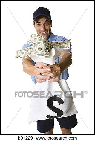 Stock Photo - Portrait of a man holding a bag full of money. Fotosearch