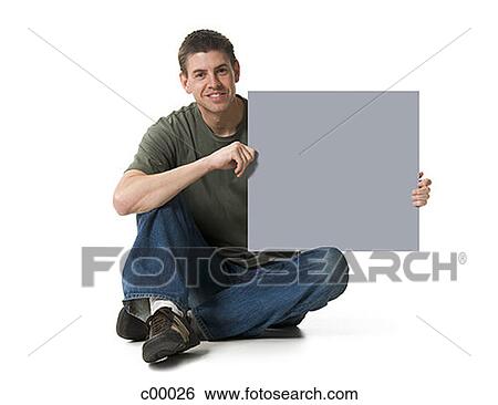 Portrait of a man holding a blank sign View Large Photo Image Stock Photograph - Portrait of a man holding a blank sign. Fotosearch
