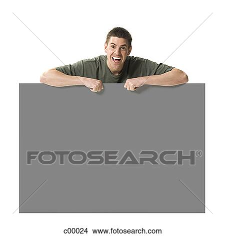 Picture - Portrait of a man leaning on a blank sign. Fotosearch