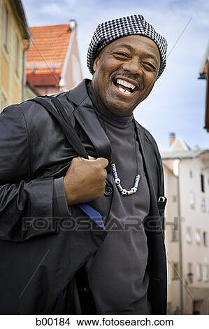 Portrait of a mature man laughing View Large Photo Image Picture - Portrait of a mature man laughing. Fotosearch