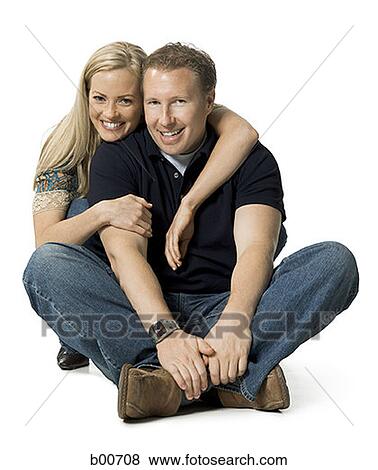 Portrait of a mid adult man and a young woman smiling View Large Photo Image Stock Photo - Portrait of a mid adult man and a young woman smiling. Fotosearch