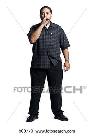 Portrait of a mid adult man smoking a cigar View Large Photo Image Stock Image - Portrait of a mid adult man smoking a cigar. Fotosearch