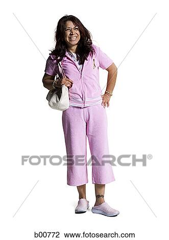 Portrait of a mid adult woman carrying a purse and smiling View Large Photo Image Stock Image - Portrait of a mid adult woman carrying a purse and smiling. Fotosearch