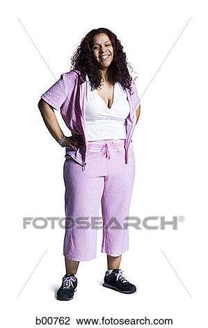 Portrait of a mid adult woman standing with her arms akimbo View Large Photo Image Stock Image - Portrait of a mid adult woman standing with her arms akimbo. Fotosearch
