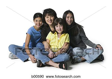Portrait of a mother sitting with her three daughters View Large Photo Image Stock Image - Portrait of a mother sitting with her three daughters. Fotosearch