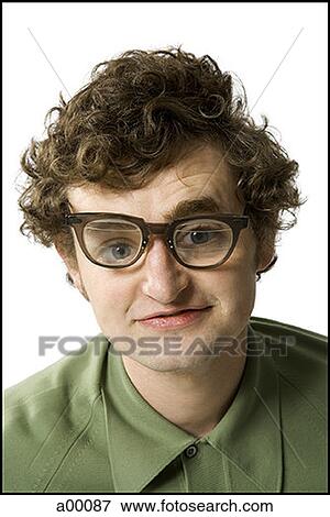 Portrait of a nerdy young man smiling View Large Photo Image Stock Photo - Portrait of a nerdy young man smiling. Fotosearch