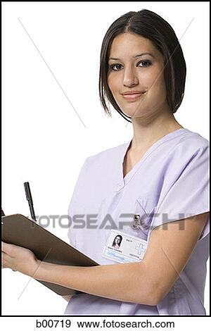 Stock Photo - Portrait of a nurse making a report. Fotosearch
