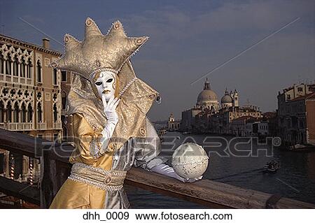 Stock Photo - Portrait of a person standing in a masquerade costume. Fotosearch