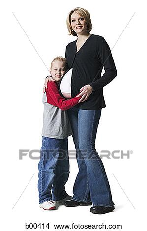 Picture - Portrait of a pregnant woman standing with her son. Fotosearch