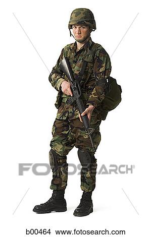 Portrait of a soldier holding a rifle View Large Photo Image Picture - Portrait of a soldier holding a rifle. Fotosearch