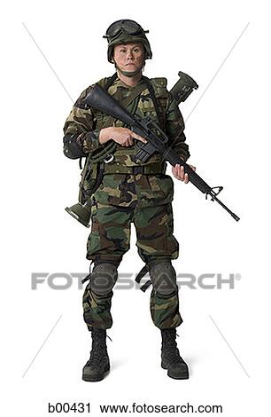 Portrait of a soldier holding a rifle View Large Photo Image Stock Image - Portrait of a soldier holding a rifle. Fotosearch