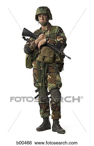 Portrait of a soldier holding a rifle View Large Photo Image Stock Photograph - Portrait of a soldier holding a rifle. Fotosearch