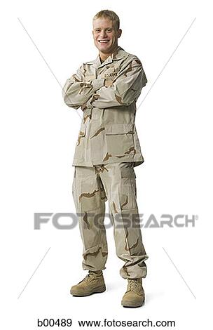Portrait of a soldier standing with his arms folded View Large Photo Image Stock Photo - Portrait of a soldier standing with his arms folded. Fotosearch