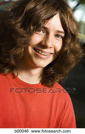 Portrait of a teenage boy smiling View Large Photo Image Stock Photograph - Portrait of a teenage boy smiling. Fotosearch