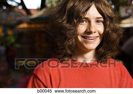 Portrait of a teenage boy smiling View Large Photo Image Stock Photography - Portrait of a teenage boy smiling. Fotosearch