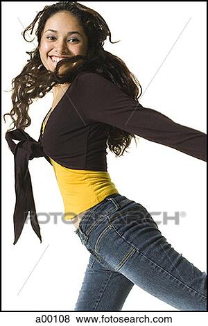 Portrait of a teenage girl smiling as she jumps up View Large Photo Image Stock Photo - Portrait of a teenage girl smiling as she jumps up. Fotosearch