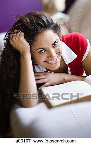 Stock Photo - Portrait of a teenage girl smiling at school. Fotosearch