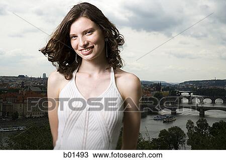 Portrait of a teenage girl smiling in front of landscape View Large Photo Image Stock Image - Portrait of a teenage girl smiling in front of landscape. Fotosearch