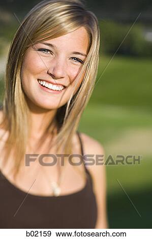 Portrait of a teenage girl smiling View Large Photo Image Stock Photo - Portrait of a teenage girl smiling. Fotosearch