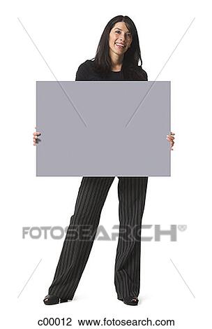 Portrait of a woman holding a blank sign View Large Photo Image Stock Image - Portrait of a woman holding a blank sign. Fotosearch