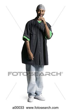 Stock Image - Portrait of a young African-American man smoking a cigarette. Fotosearch