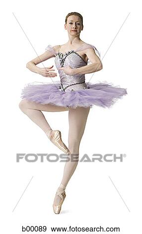 Stock Photo - Portrait of a young ballet dancer standing on her one leg. Fotosearch