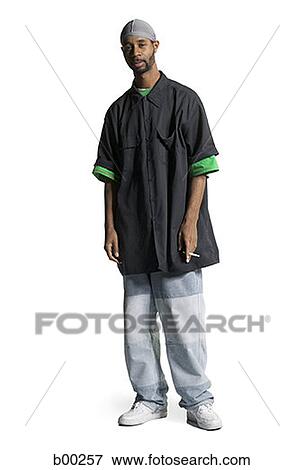 Stock Photo - Portrait of a young Black man holding a cigarette. Fotosearch
