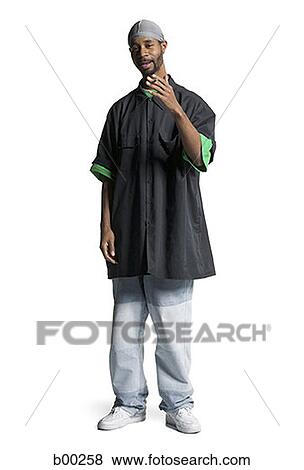Portrait of a young Black man smoking a cigarette View Large Photo Image Stock Photo - Portrait of a young Black man smoking a cigarette. Fotosearch