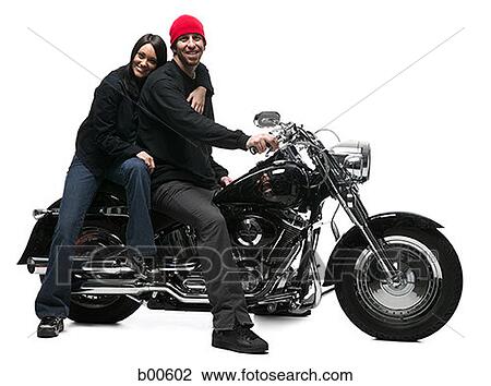 Portrait of a young couple sitting on a motorcycle View Large Photo Image Stock Image - Portrait of a young couple sitting on a motorcycle. Fotosearch