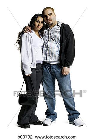 Portrait of a young couple standing View Large Photo Image Stock Image - Portrait of a young couple standing. Fotosearch