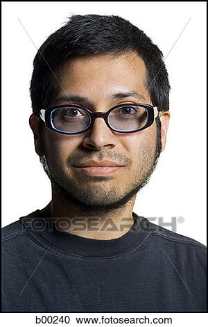 Portrait of a young ethnic man wearing eyeglasses View Large Photo Image Stock Image - Portrait of a young ethnic man wearing eyeglasses. Fotosearch