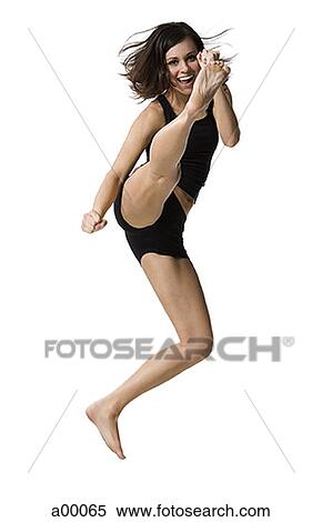 Portrait of a young girl kicking View Large Photo Image Stock Photography - Portrait of a young girl kicking. Fotosearch