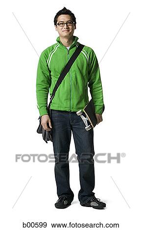 Portrait of a young man and holding a skateboard View Large Photo Image Stock Photo - Portrait of a young man and holding a skateboard. Fotosearch