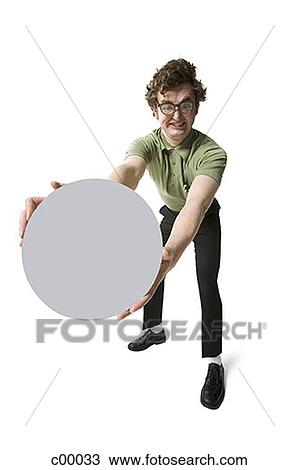 Portrait of a young man holding a blank sign View Large Photo Image Stock Image - Portrait of a young man holding a blank sign. Fotosearch
