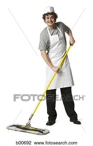 Portrait of a young man holding a mop View Large Photo Image Stock Image - Portrait of a young man holding a mop. Fotosearch