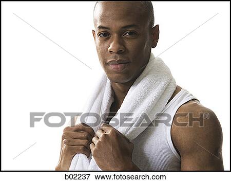Portrait of a young man holding a towel around his neck View Large Photo Image Stock Photo - Portrait of a young man holding a towel around his neck. Fotosearch
