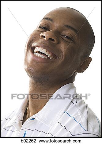 Stock Image - Portrait of a young man laughing. Fotosearch