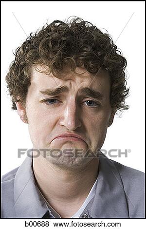 Stock Photo - Portrait of a young man making a face. Fotosearch