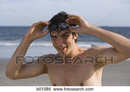 Portrait of a young man on the beach View Large Photo Image Stock Photography - Portrait of a young man on the beach. Fotosearch