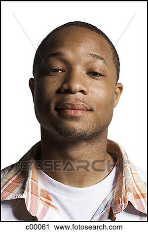 Portrait of a young man posing View Large Photo Image Stock Image - Portrait of a young man posing. Fotosearch