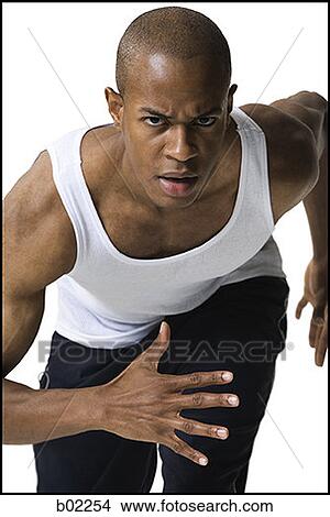 Picture - Portrait of a young man running. Fotosearch