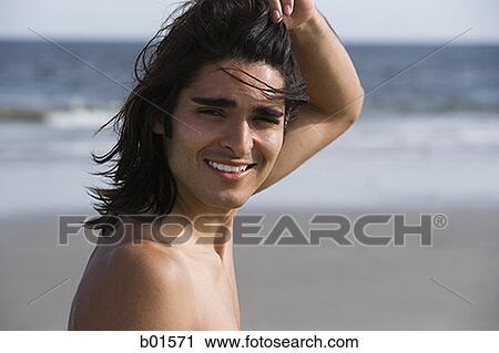 Portrait of a young man smiling on the beach View Large Photo Image Stock Image - Portrait of a young man smiling on the beach. Fotosearch