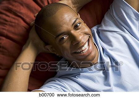 Portrait of a young man smiling View Large Photo Image Stock Image - Portrait of a young man smiling. Fotosearch
