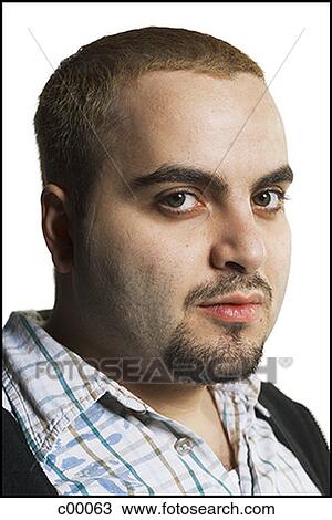 Stock Image - Portrait of a young man smiling. Fotosearch