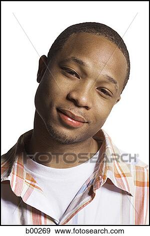 Portrait of a young man smiling View Large Photo Image Stock Photo - Portrait of a young man smiling. Fotosearch