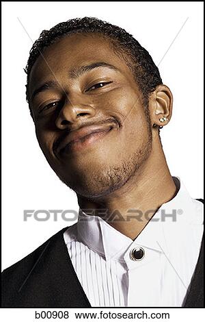 Portrait of a young man smiling View Large Photo Image Stock Photo - Portrait of a young man smiling. Fotosearch