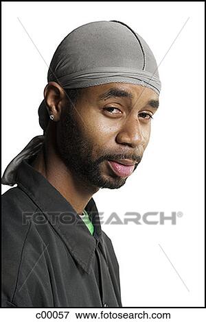 Portrait of a young man wearing a bandana View Large Photo Image Stock Photo - Portrait of a young man wearing a bandana. Fotosearch