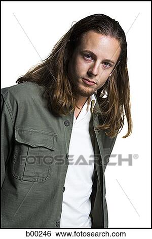 Stock Photograph - Portrait of a young man with long hair. Fotosearch