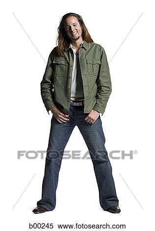 Portrait of a young man with long hair, smiling View Large Photo Image Stock Photography - Portrait of a young man with long hair, smiling. Fotosearch