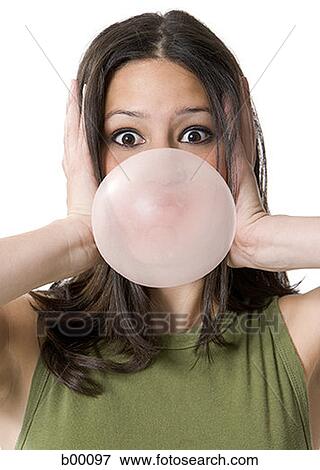 Portrait of a young woman blowing bubble gum View Large Photo Image Stock Photo - Portrait of a young woman blowing bubble gum. Fotosearch